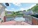 Backyard deck overlooking tranquil waterfront area with a table, perfect for outdoor gatherings at 7846 Park North Cir, Indianapolis, IN 46260
