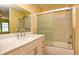 Modern bathroom featuring a white vanity with sleek fixtures and a glass-enclosed shower/tub combo at 7846 Park North Cir, Indianapolis, IN 46260