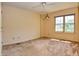 Neutral bedroom featuring a ceiling fan and natural light from a window at 7846 Park North Cir, Indianapolis, IN 46260