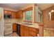 Bright kitchen with wooden cabinets, stainless steel sink, and a view of the eating area at 7846 Park North Cir, Indianapolis, IN 46260