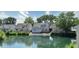 Backyard view of a home featuring a waterfront, serene environment with neighboring houses at 7846 Park North Cir, Indianapolis, IN 46260