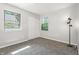 Bright bedroom features new carpet, fresh paint, windows, and a closet at 7914 Trotwood Cir, Indianapolis, IN 46256