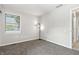 Neutral bedroom features new carpet, fresh paint, and great natural light from the large window at 7914 Trotwood Cir, Indianapolis, IN 46256