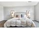Bright bedroom showcasing a comfy bed with decorative pillows and bedside tables at 7914 Trotwood Cir, Indianapolis, IN 46256