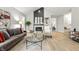 Spacious living area featuring a cozy fireplace, built-in shelving, and stylish furnishings at 7914 Trotwood Cir, Indianapolis, IN 46256