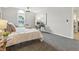 Serene main bedroom featuring plush carpeting, a comfortable bed, and a decorative ceiling fan at 7914 Trotwood Cir, Indianapolis, IN 46256