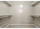 A walk-in closet featuring shelving for clothing and accessories at 7914 Trotwood Cir, Indianapolis, IN 46256