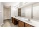 Bathroom with dual vanity, large mirror and walk-in closet at 7919 Cool Hollow Pl, Indianapolis, IN 46237