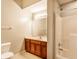 Bright bathroom with shower/tub, wood vanity and tile floor at 7919 Cool Hollow Pl, Indianapolis, IN 46237