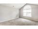 Carpeted bedroom has vaulted ceiling, window, and neutral paint at 7919 Cool Hollow Pl, Indianapolis, IN 46237