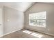 This carpeted bedroom features natural light at 7919 Cool Hollow Pl, Indianapolis, IN 46237