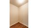 Corner view of room showing wood floors and neutral paint at 7919 Cool Hollow Pl, Indianapolis, IN 46237