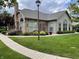 Charming clubhouse exterior with stone accents, large windows, and manicured landscaping at 7919 Cool Hollow Pl, Indianapolis, IN 46237