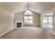 Bright living room featuring a fireplace, large window, and neutral carpet, offering a cozy atmosphere at 7919 Cool Hollow Pl, Indianapolis, IN 46237