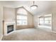 Spacious living room featuring a fireplace, neutral carpet, and arched windows for ample natural light at 7919 Cool Hollow Pl, Indianapolis, IN 46237