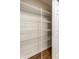 Walk-in pantry features wire shelving and hardwood floors at 7919 Cool Hollow Pl, Indianapolis, IN 46237