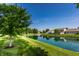 Scenic pond view surrounded by lush green landscaping in a tranquil community setting at 7919 Cool Hollow Pl, Indianapolis, IN 46237