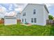 The home's vast backyard featuring an outdoor shed and patio seating area at 9593 W Constellation Dr, Pendleton, IN 46064
