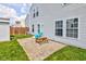 Home's backyard features a brick patio seating area, fenced in yard, and outdoor shed at 9593 W Constellation Dr, Pendleton, IN 46064