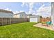 A spacious backyard features an outdoor shed and patio seating area next to the home at 9593 W Constellation Dr, Pendleton, IN 46064