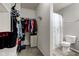 Attached walk-in closet and bathroom featuring a shower with a decorative shower curtain and toilet at 9593 W Constellation Dr, Pendleton, IN 46064