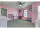 Spacious pink themed bedroom with great natural light from two large windows at 9593 W Constellation Dr, Pendleton, IN 46064