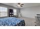 Primary bedroom showcasing a queen bed, ceiling fan and natural light from two windows at 9593 W Constellation Dr, Pendleton, IN 46064