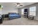 Primary bedroom with neutral paint, a ceiling fan, and bright windows at 9593 W Constellation Dr, Pendleton, IN 46064