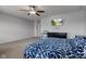 Primary bedroom with neutral paint, a ceiling fan, and bright windows with television on the wall at 9593 W Constellation Dr, Pendleton, IN 46064