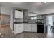 Modern kitchen with a stainless steel sink and faucet with stylish countertops and an elegant mosaic backsplash at 9593 W Constellation Dr, Pendleton, IN 46064