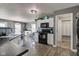 Modern kitchen with stainless steel appliances, a mosaic backsplash, countertops, and ample white cabinetry at 9593 W Constellation Dr, Pendleton, IN 46064