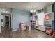 Bright living room with hardwood flooring, open shelving, and lots of space for entertaining and enjoyment at 9593 W Constellation Dr, Pendleton, IN 46064