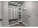 Bright mudroom with built-in shelving, coat hooks, and a comfortable bench seating area at 9593 W Constellation Dr, Pendleton, IN 46064