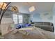 Spacious playroom with cloud mural, carpet and ample natural light at 9593 W Constellation Dr, Pendleton, IN 46064