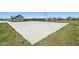 Neighborhood basketball court with green grass, providing an outdoor athletic space for residents at 9916 Gallop Ln, Fishers, IN 46040