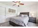 Bright bedroom with neutral carpet featuring a full bed, nightstands and natural lighting at 9916 Gallop Ln, Fishers, IN 46040