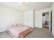 Bright bedroom featuring neutral carpet and a full bed with a pale pink comforter at 9916 Gallop Ln, Fishers, IN 46040