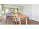 Inviting dining area with a wooden table, chairs, and view into the living room at 9916 Gallop Ln, Fishers, IN 46040