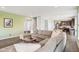 Open concept living room featuring a large sectional sofa and modern decor at 9916 Gallop Ln, Fishers, IN 46040