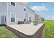 Exterior view of a home's patio with a seating area and well-maintained lawn at 9916 Gallop Ln, Fishers, IN 46040