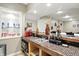 Finished basement bar area featuring tile countertops, stainless steel sink, and decor at 1013 Chapman Blvd, Greenfield, IN 46140