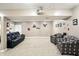 Basement with plush seating, framed photos, movie decor, and neutral colored walls at 1013 Chapman Blvd, Greenfield, IN 46140