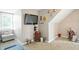 Cozy carpeted bedroom with a comfortable sitting area, natural light, and decorative wall art at 1013 Chapman Blvd, Greenfield, IN 46140