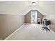 Bright bedroom with a pitched ceiling, large window, carpet flooring, and neutral paint color at 1013 Chapman Blvd, Greenfield, IN 46140