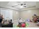 Bright bedroom with a ceiling fan, closet, and playful decor for a fun and inviting space at 1013 Chapman Blvd, Greenfield, IN 46140