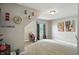 Bright bedroom featuring a window with stylish curtains, carpet flooring, and neutral wall color at 1013 Chapman Blvd, Greenfield, IN 46140