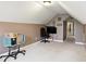 Neutral carpeted bedroom with TV, rolling chairs, and ample space for flexible use at 1013 Chapman Blvd, Greenfield, IN 46140