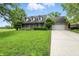 Attractive home with a spacious front yard, a covered porch and an attached garage at 1013 Chapman Blvd, Greenfield, IN 46140