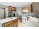 Bright kitchen with white appliances, an island, and plenty of cabinet space at 1013 Chapman Blvd, Greenfield, IN 46140