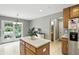 Neutral kitchen with a center island and views to the rear of the home at 1013 Chapman Blvd, Greenfield, IN 46140